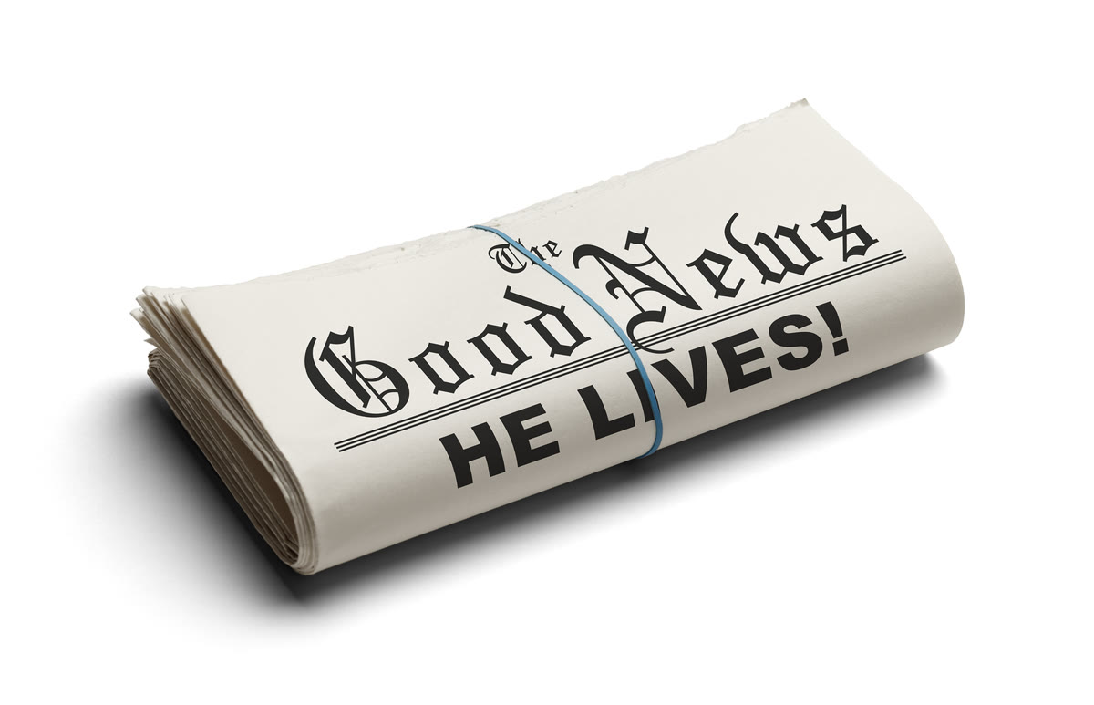 A folded newspaper reading: The Good News, He Lives!